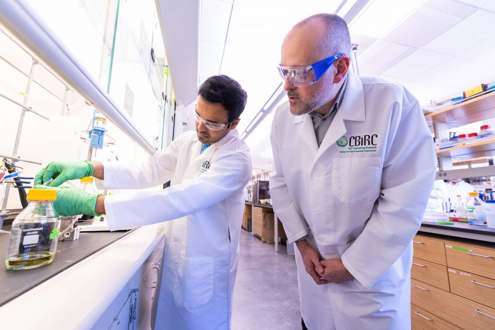   Jean-Philippe Tessonnier, right, and Prathamesh Prabhu, a doctoral student, work in Iowa State's Biorenewables Research Laboratory.