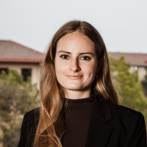 An ISU student smiles and looks at the camera.