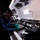 A researcher works on a 3D printing project in an Iowa State facility in the Quad Cities.