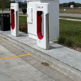 A bank of public electric vehicle chargers at an Ames gas station.