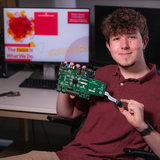 Chase O'Connell in a Coover Hall lab with his honors project