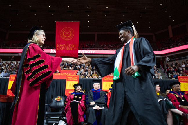 President Wintersteen congratulates students at fall 2023 commencement in Hilton Coliseum.