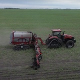 A farmer applies nitrogen fertilizer to a corn field in Boone County in June 2024.